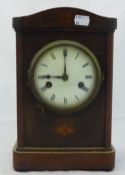 An Edwardian inlaid oak mantle clock