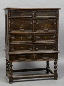 An 18th century oak geometric moulded chest on stand The moulded rectangular top above an