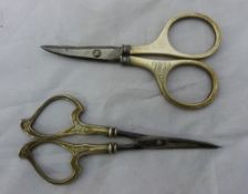 Two pairs of silver handled scissors