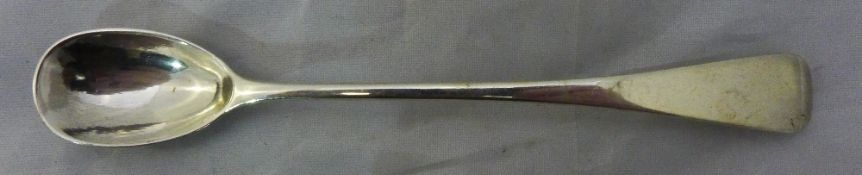 A long silver mustard spoon