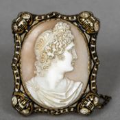 A 19th century unmarked gold and enamel decorated cameo brooch Centrally carved with a classical