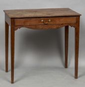 A George III mahogany side table The moulded rectangular top above a single frieze drawer and a