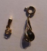 A 14 ct gold pendant and a 9 ct gold pendant