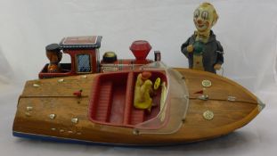 Three tin plate toys including a speed boat