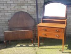 An Edwardian dressing table and a walnut bed