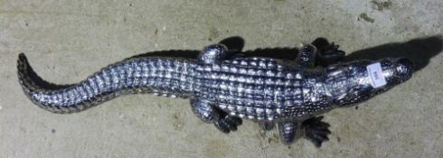 A silvered model of a crocodile