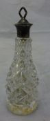 An English silver top and glass perfume bottle