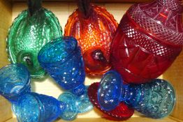 A quantity of coloured moulded glass ware