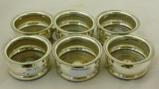 A set of six silver plated coasters