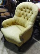 A Victorian button back upholstered armchair