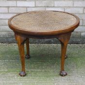 An early 20th century cane topped coffee table