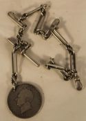 A silver Albert chain set with a George IV silver coin