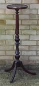 A mahogany torchere