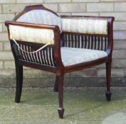 An Edwardian inlaid mahogany tub chair