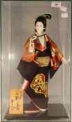 A cased model of a Geisha girl