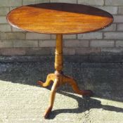 A 19th century mahogany and yew wood tripod table