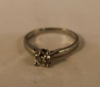 A platinum and diamond solitaire ring