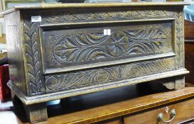 A late 19th/early 20th century carved oak blanket box