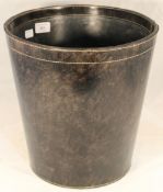 A round leather bin