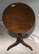 A 19th century mahogany tilt top tripod table