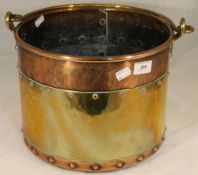 A copper and brass coal bucket