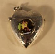 A silver vesta in the form of a heart