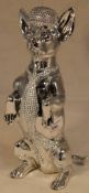 A silvered model of a Chihuahua wearing a jazzy hat