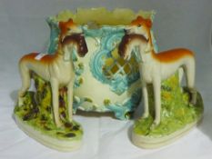 A pair of greyhound and hare flatbacks and a pottery jardiniere
