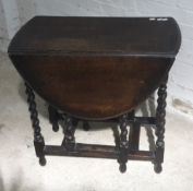 A barley twist drop leaf table