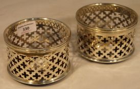 A pair of silver plated coasters