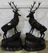 A pair of bronze stags