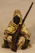 A cold painted bronze model of an Arab
