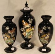 A Victorian triple garniture of bird decorated glass vases,