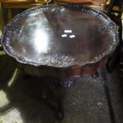 An early 20th century walnut coffee table