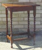 An oak barley twist side table