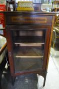 An Edwardian mahogany cabinet and a musical cigarette box