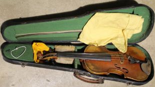 A cased violin,