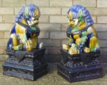 A large pair of Chinese pottery dogs of fo