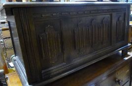 An early 20th century linen fold blanket box