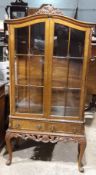 A walnut display cabinet