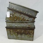 Four small Hovis tins