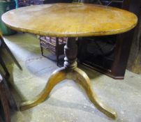 A 19th century pine topped tripod table