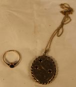 A 9 ct gold photo pendant and a 9 ct gold ring