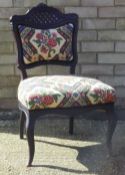 A Victorian mahogany nursing chair