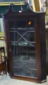 A Georgian mahogany hanging corner cabinet