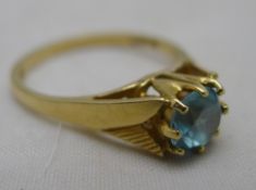 A 9 ct gold and blue stone ring