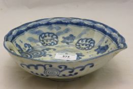 A Chinese blue and white bowl decorated with fish