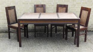 A modern Eastern dining table together with four matching chairs