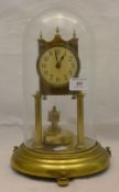 A gilt metal anniversary clock under glass dome