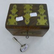 A Victorian brass bound walnut tea caddy together with a Georgian silver caddy spoon
